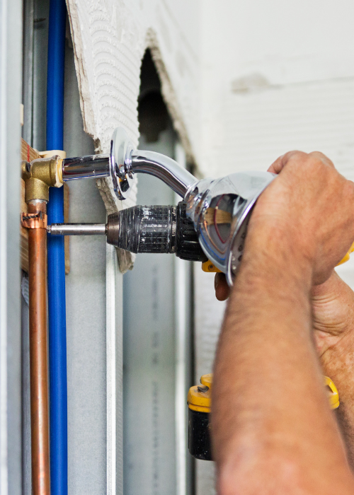 plumber inspecting sewer pipe in older Maryborough Queensland home